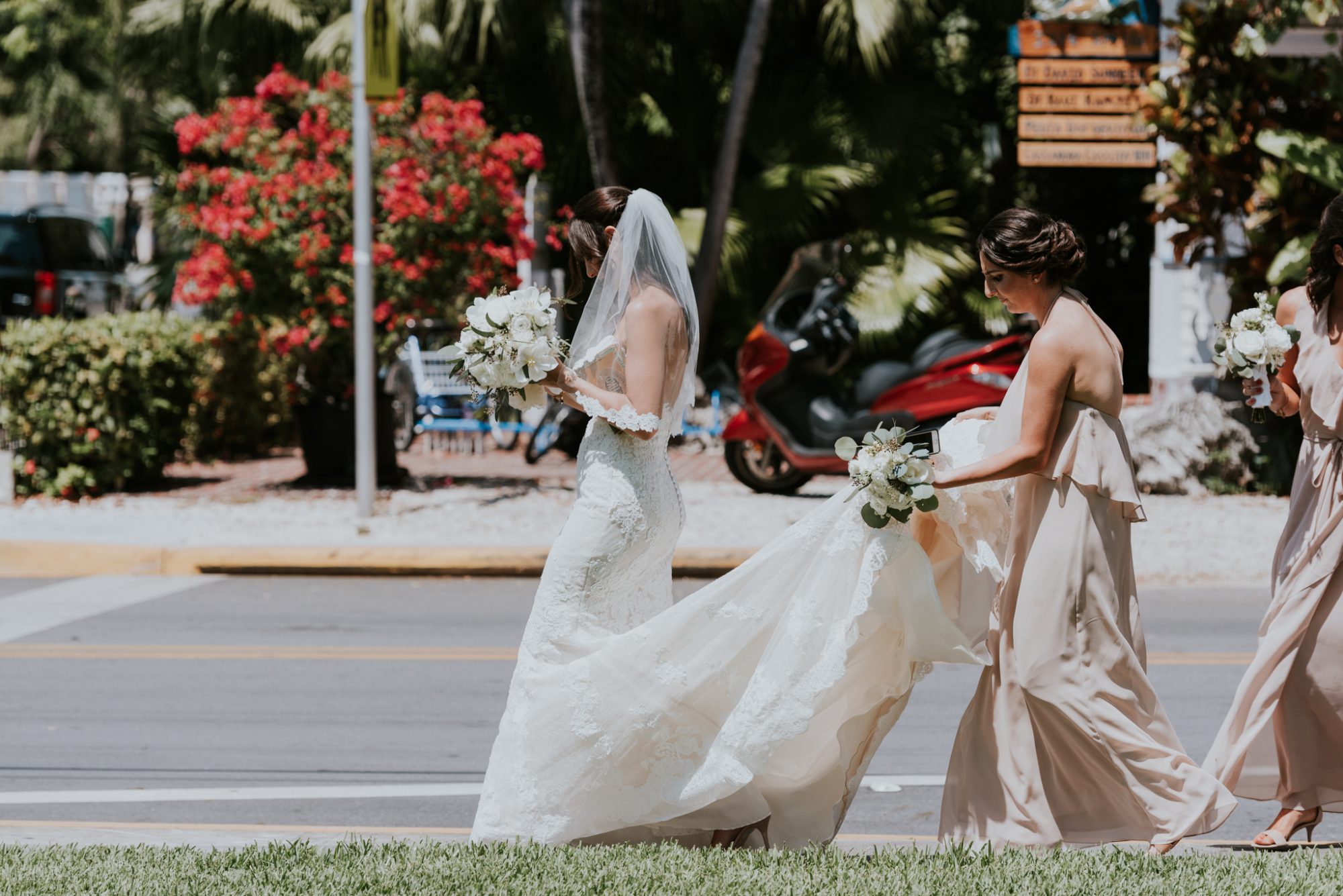 Erika and David's bridesmaids are walking down the street in Key West.