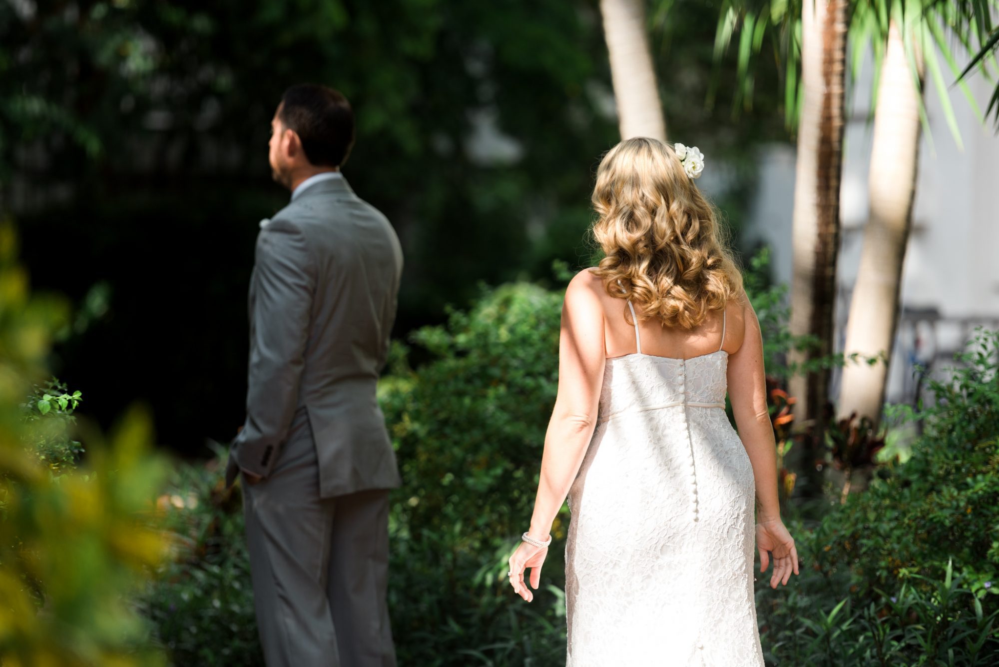 A couple's elegant wedding ceremony at the Key West Audubon House and Gardens.