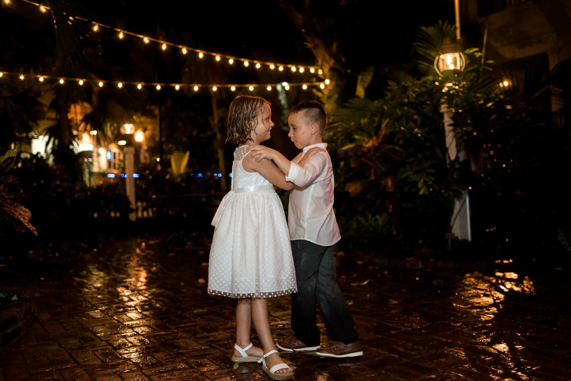 A boy and a girl dancing at night, Key West Audubon House and Gardens wedding.