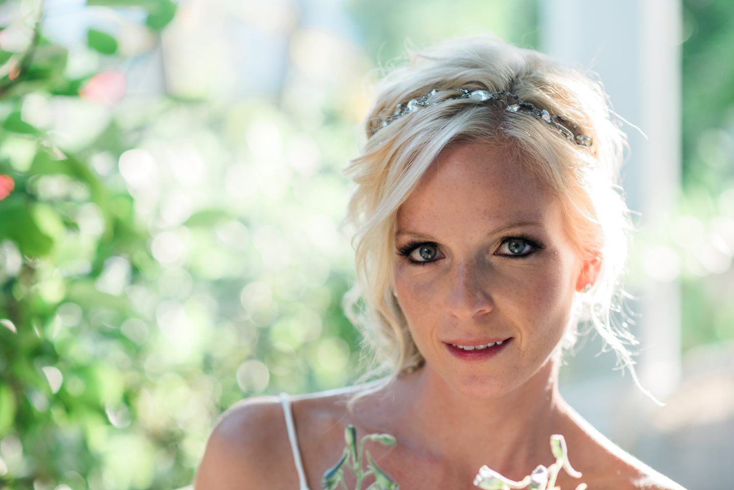 A beautiful bride holding a bouquet of flowers at a Key West Garden Club wedding.