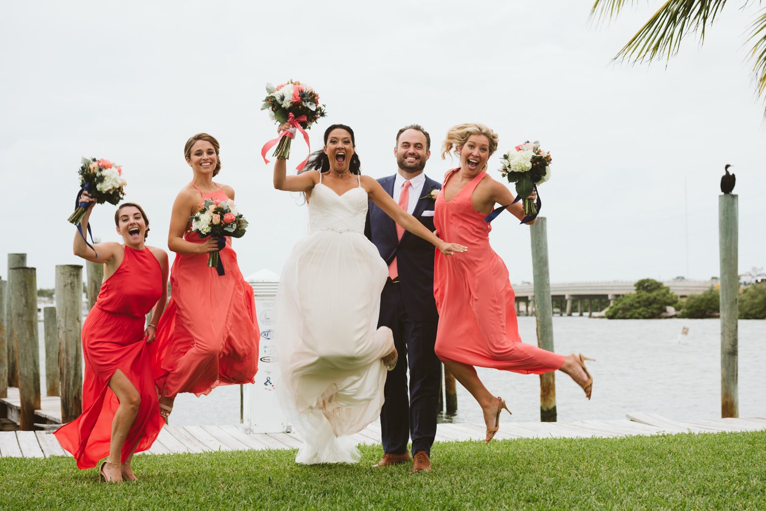 A group of bridesmaids jumping in the air at a Florida Keys wedding.