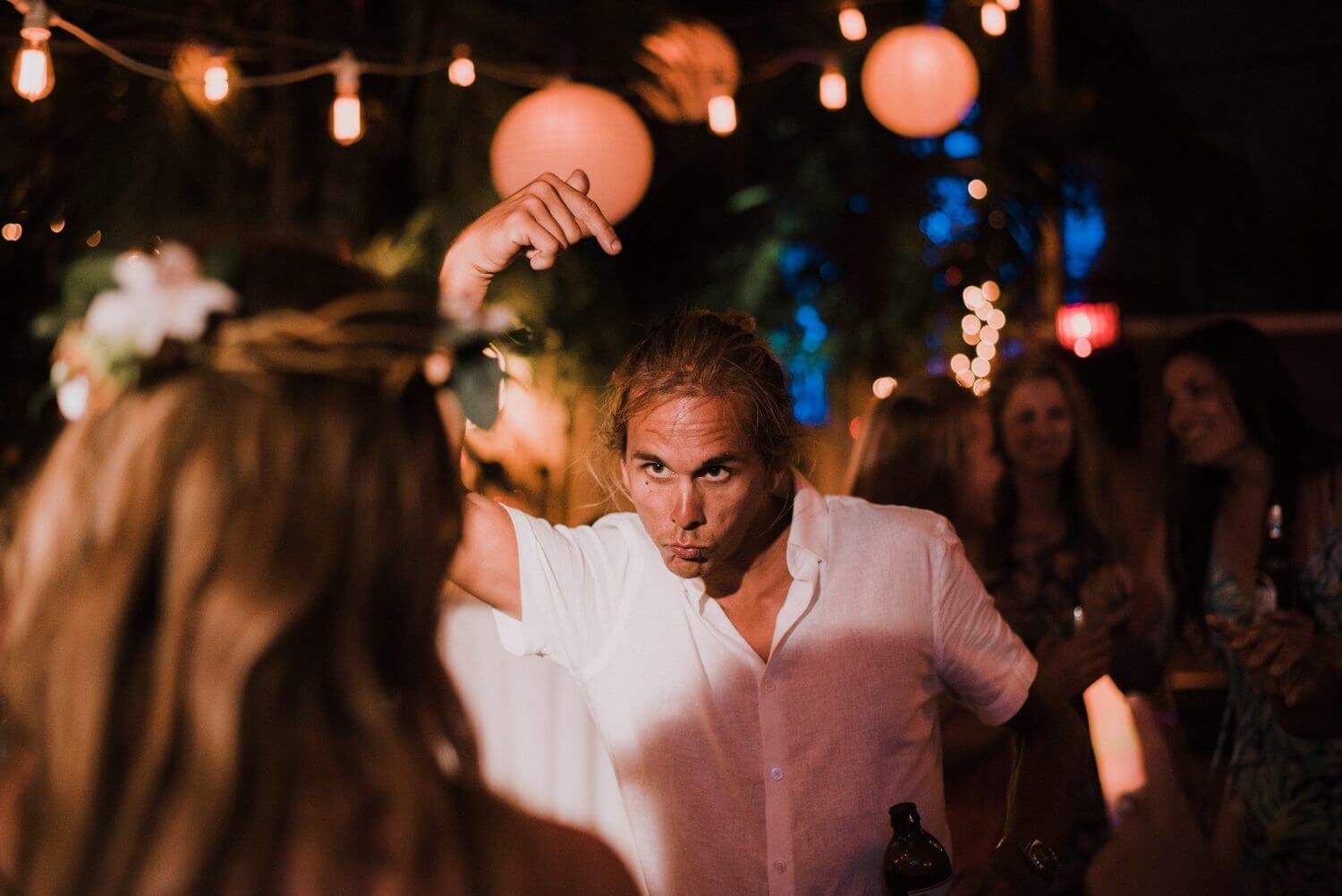 A man dancing at a wedding.