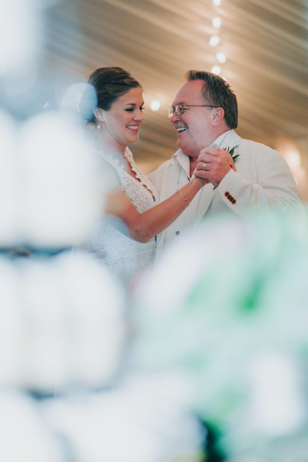 A bride and groom sharing a dance at their Ocean Key Resort Spa wedding reception in Key West.