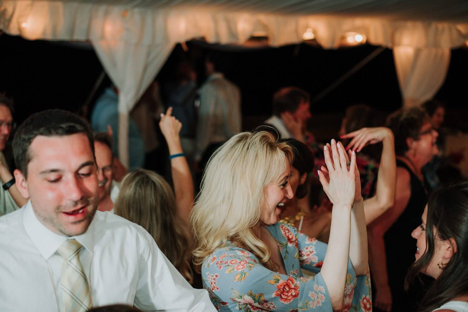 A group dancing at an Ocean Key Resort Spa wedding reception in Key West.