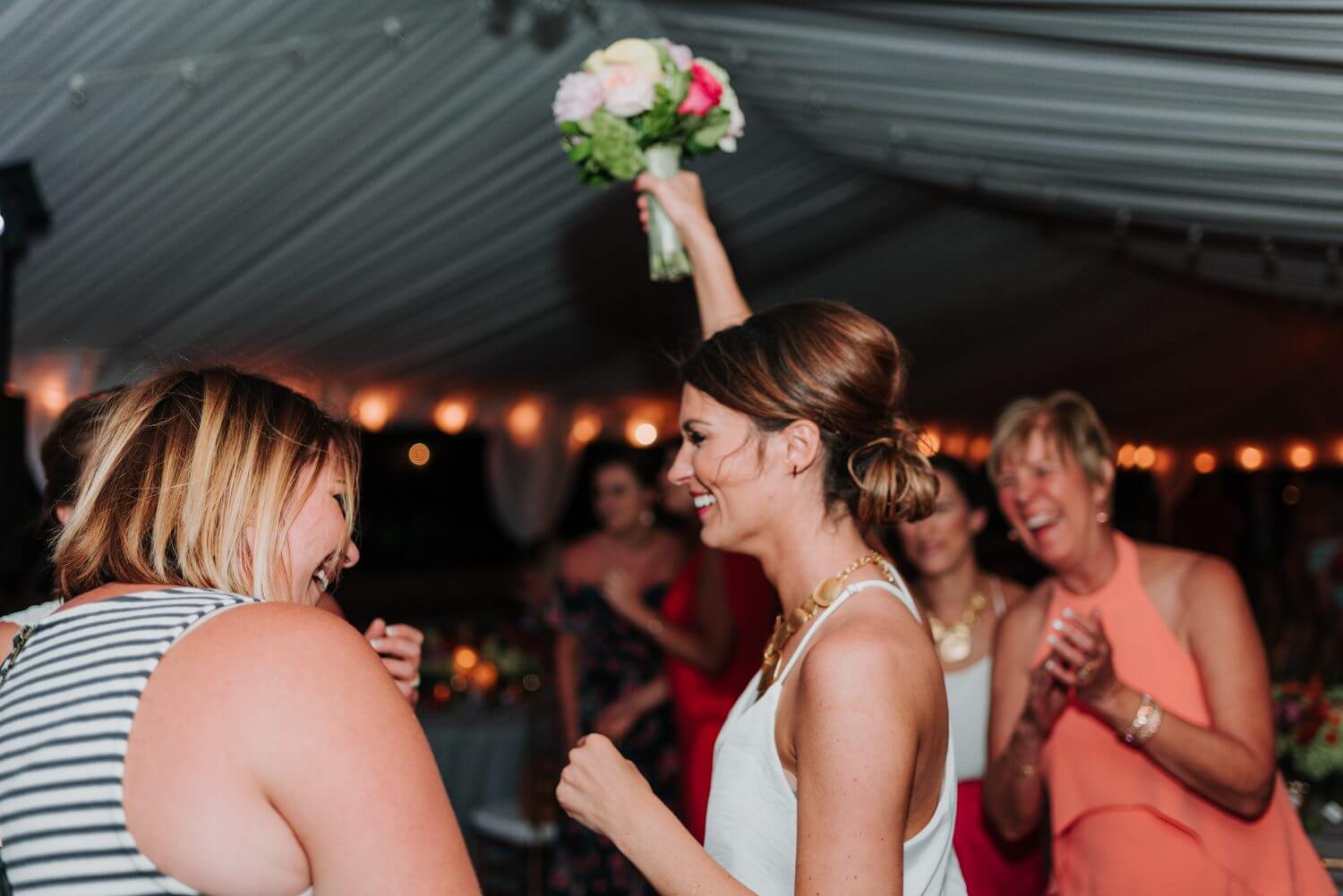 A woman is holding a bouquet at an Ocean Key Resort Spa Wedding in Key West.