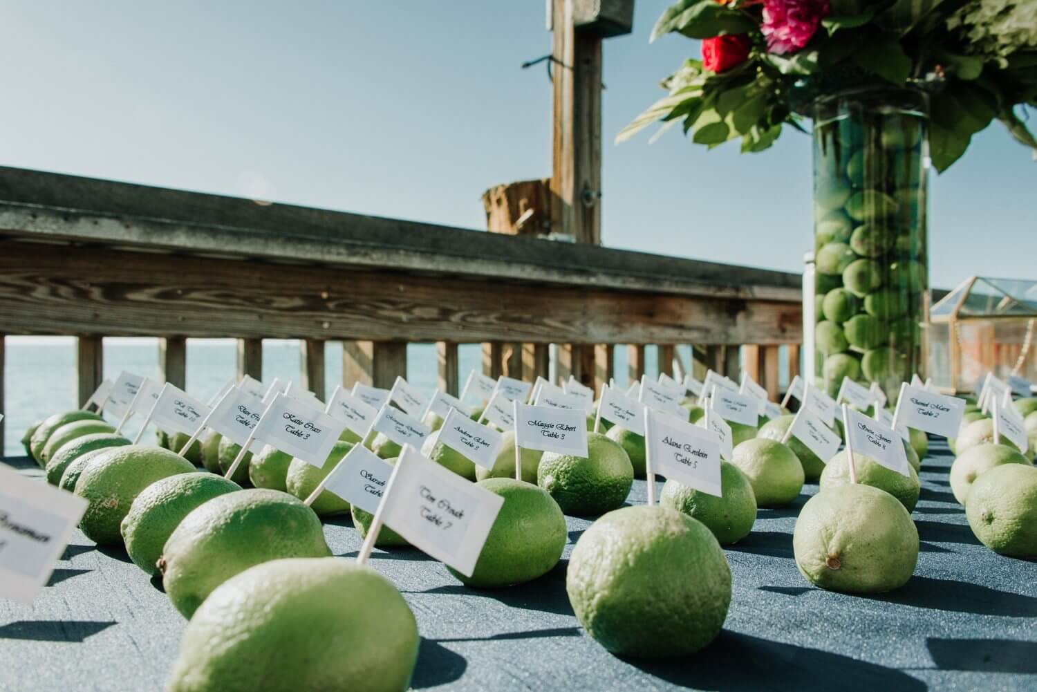 A table with limes and place cards on it at an Ocean Key Resort Spa Wedding in Key West.