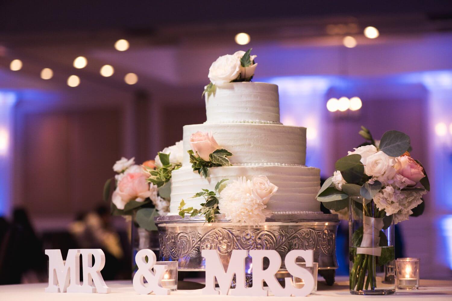 A wedding cake with "mr and mrs" written on it at Marriott Beachside Key West.