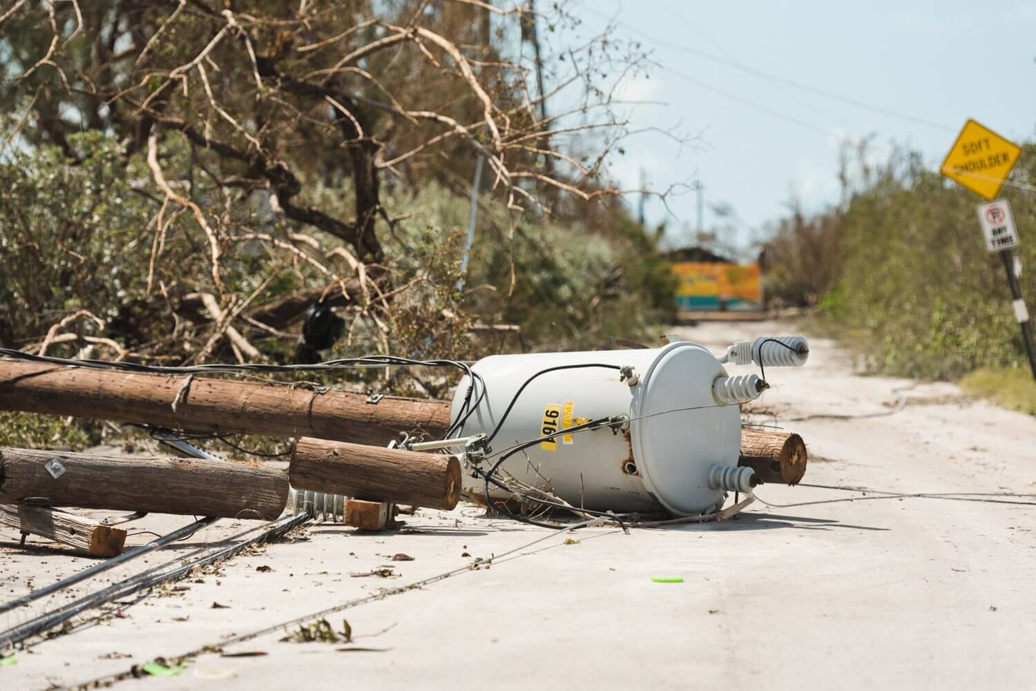 A fallen power pole on a road in the Bahamas caused by Hurricane Irma.