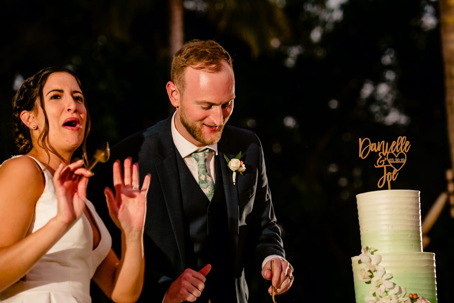 A wedding cake being cut at Bakers Cay Resort.