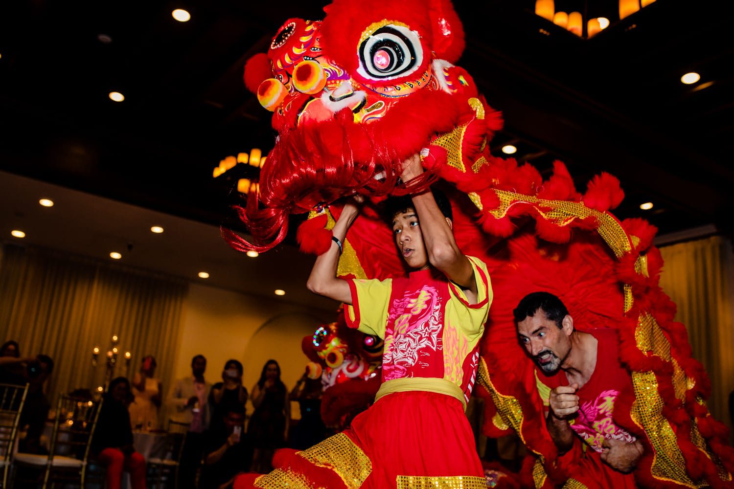 Chinese lion dance at a wedding reception.