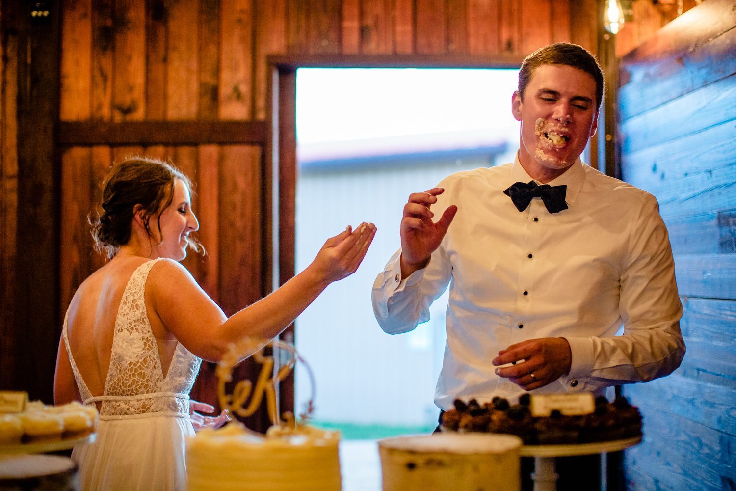 A couple enjoying their wedding cake in Steamboat Springs.