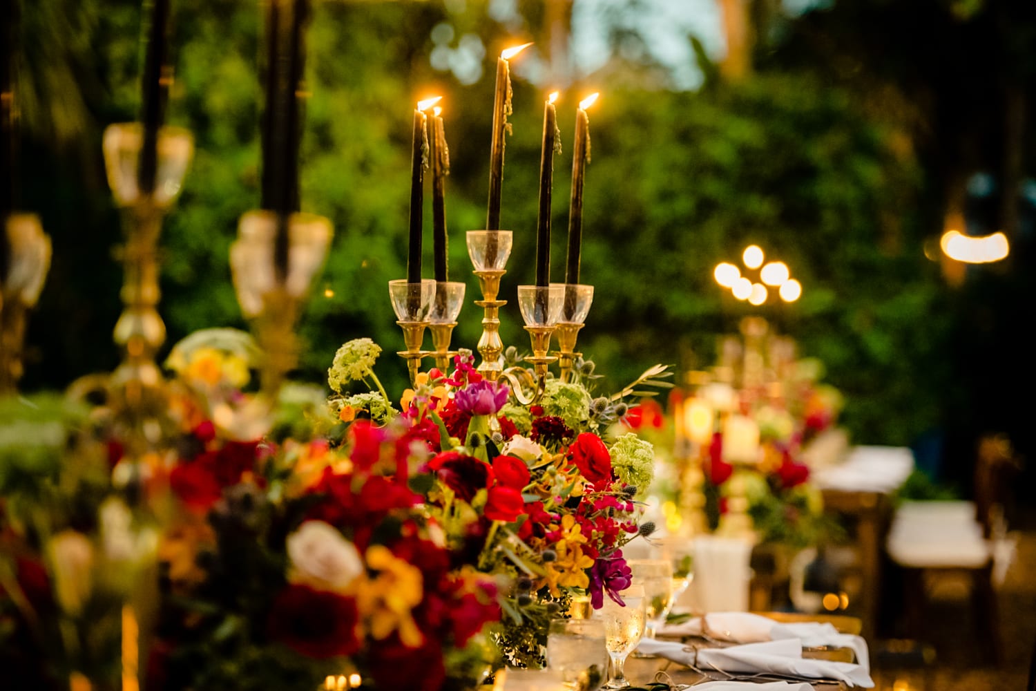 A Hemingway-themed wedding set up with candles and flowers at the historic home.