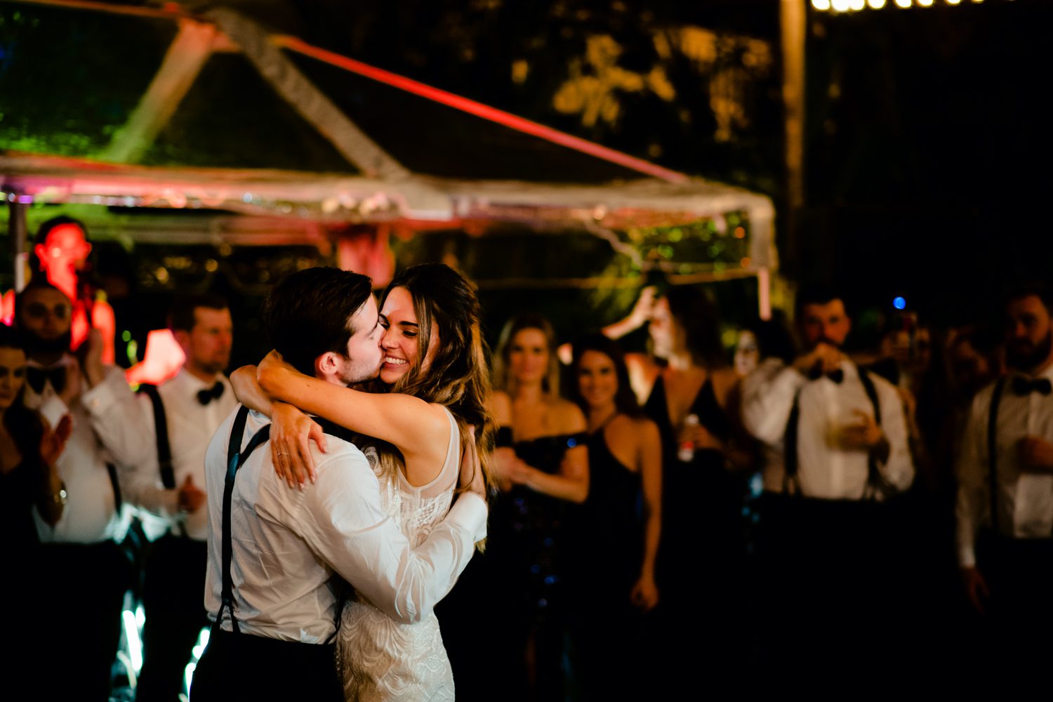 Shana and Patrick hugging during their first dance at Hemingway House Weddings.
