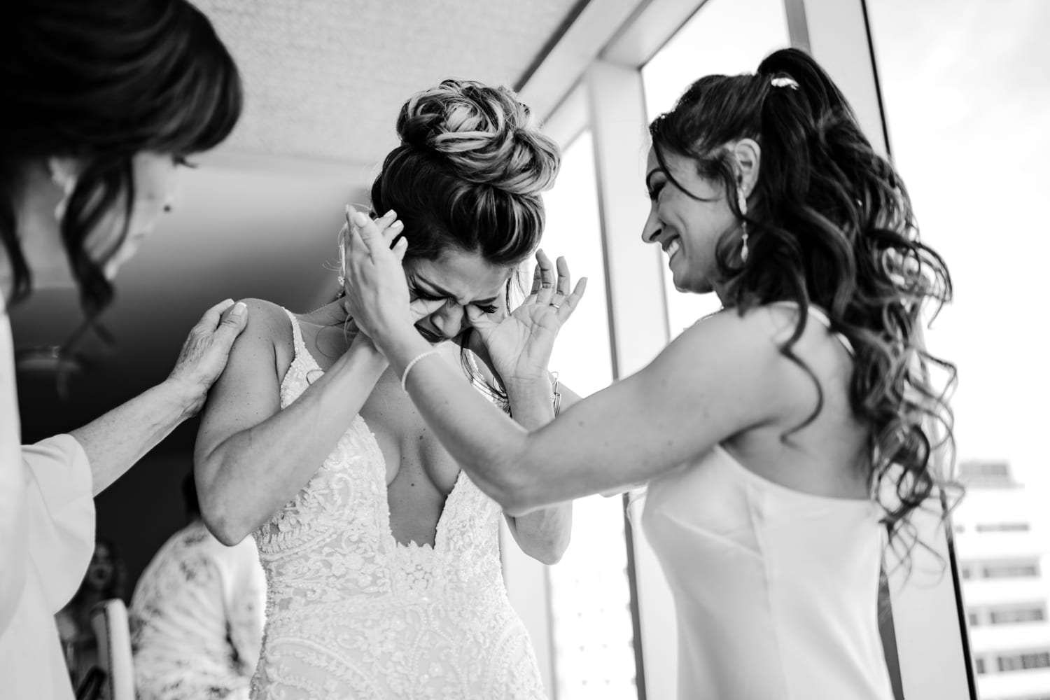 A bride and her bridesmaids are getting ready for their wedding at Eden Roc Resort in Miami.