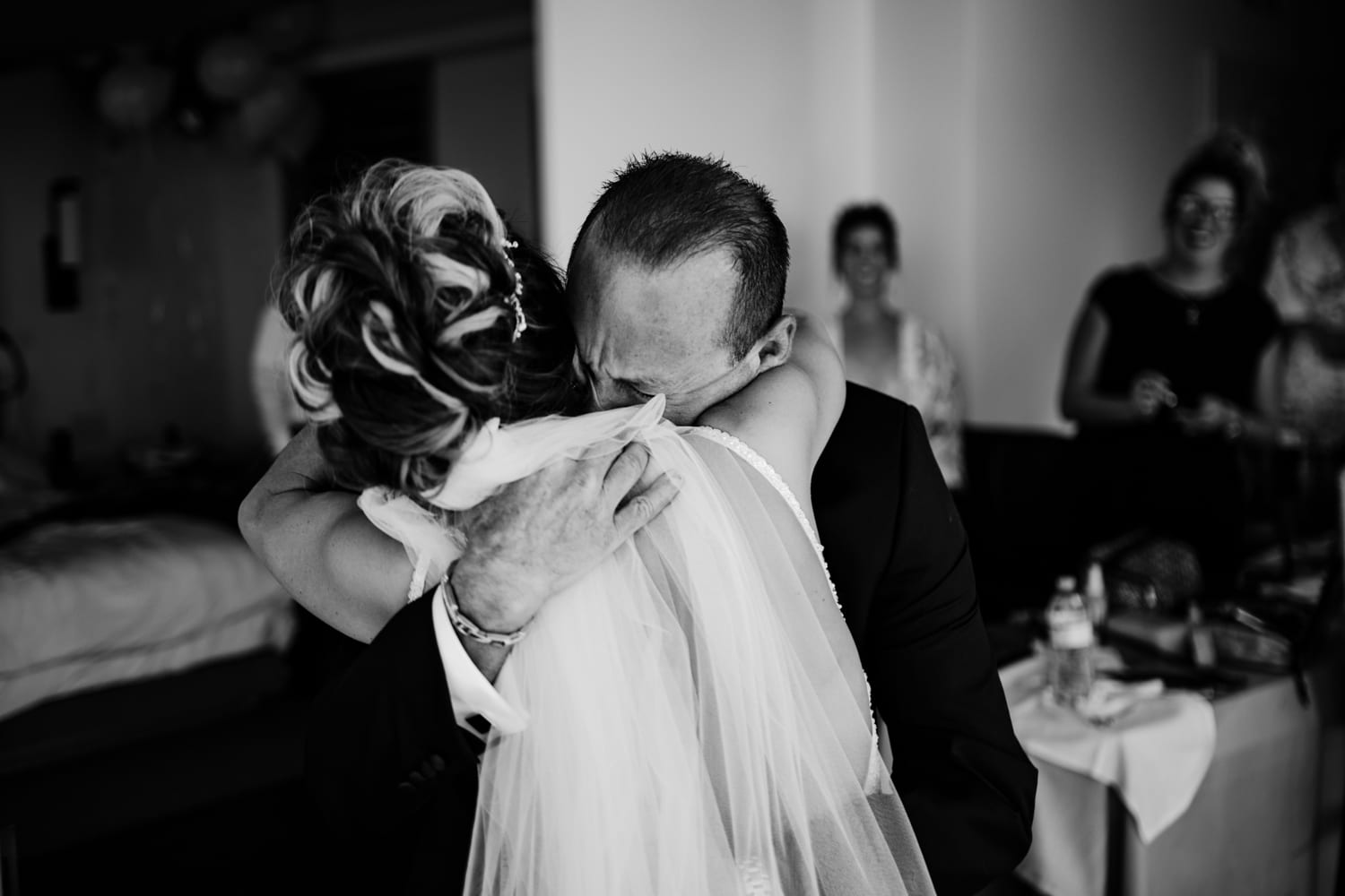 A bride is hugging her father during a wedding at Eden Roc Resort Miami.