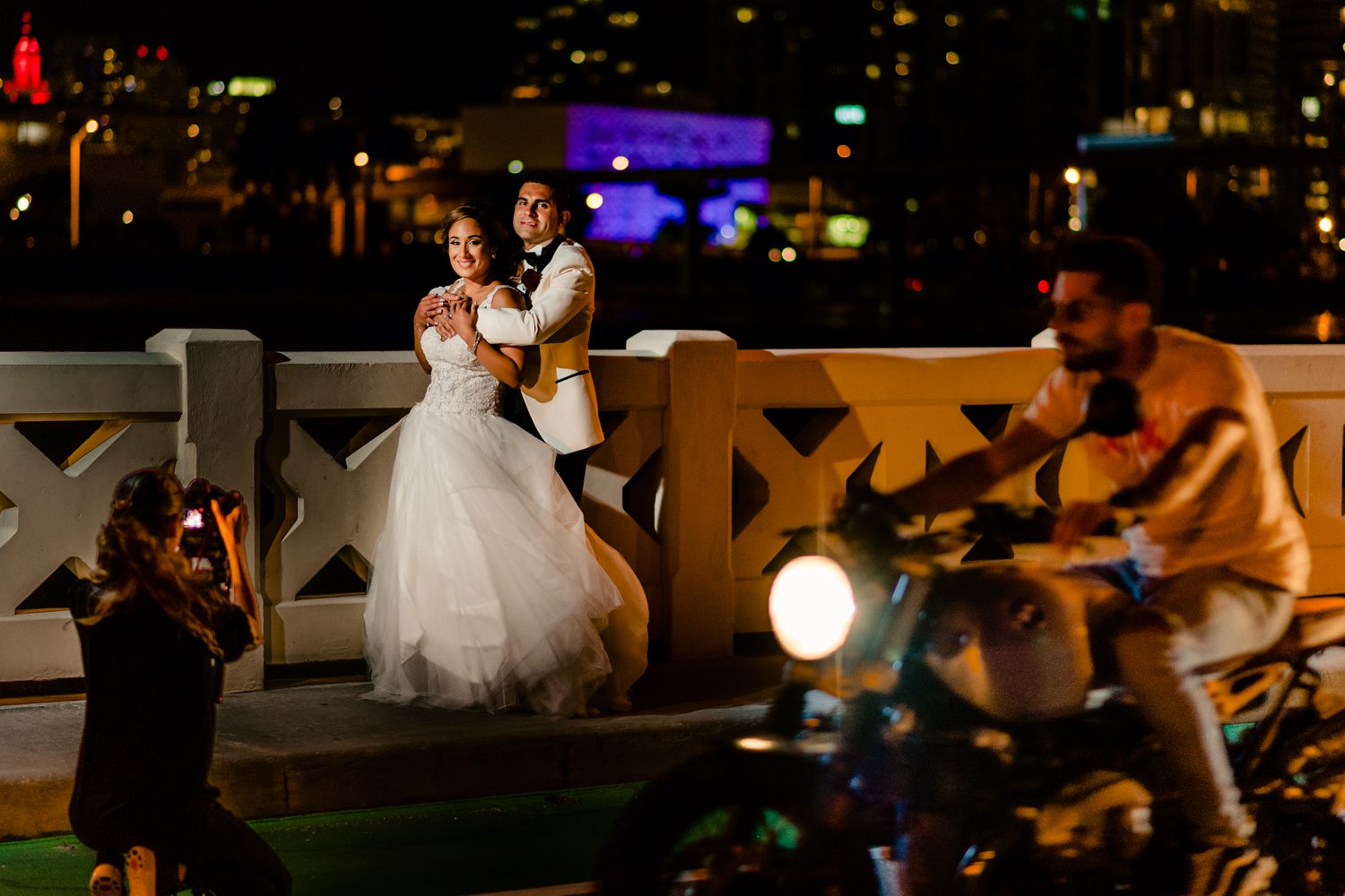 A Miami Beach wedding photographer captures a bride and groom on a motorcycle.