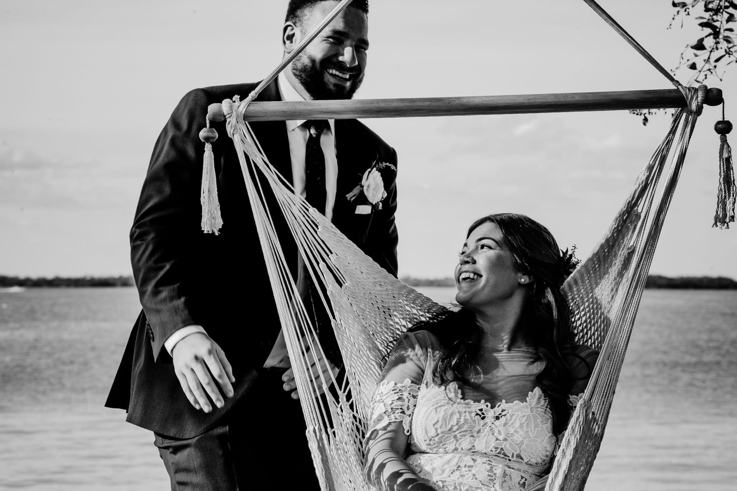 first look between bride and groom under the tropical trees of playa largo resort in key largo florida
