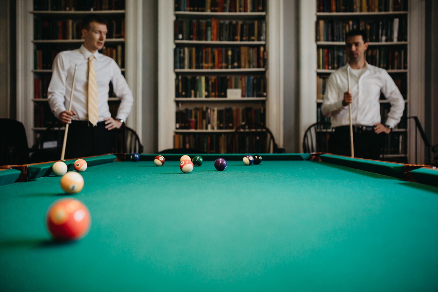 Two men playing billiards at the Cosmos Club in Washington DC.