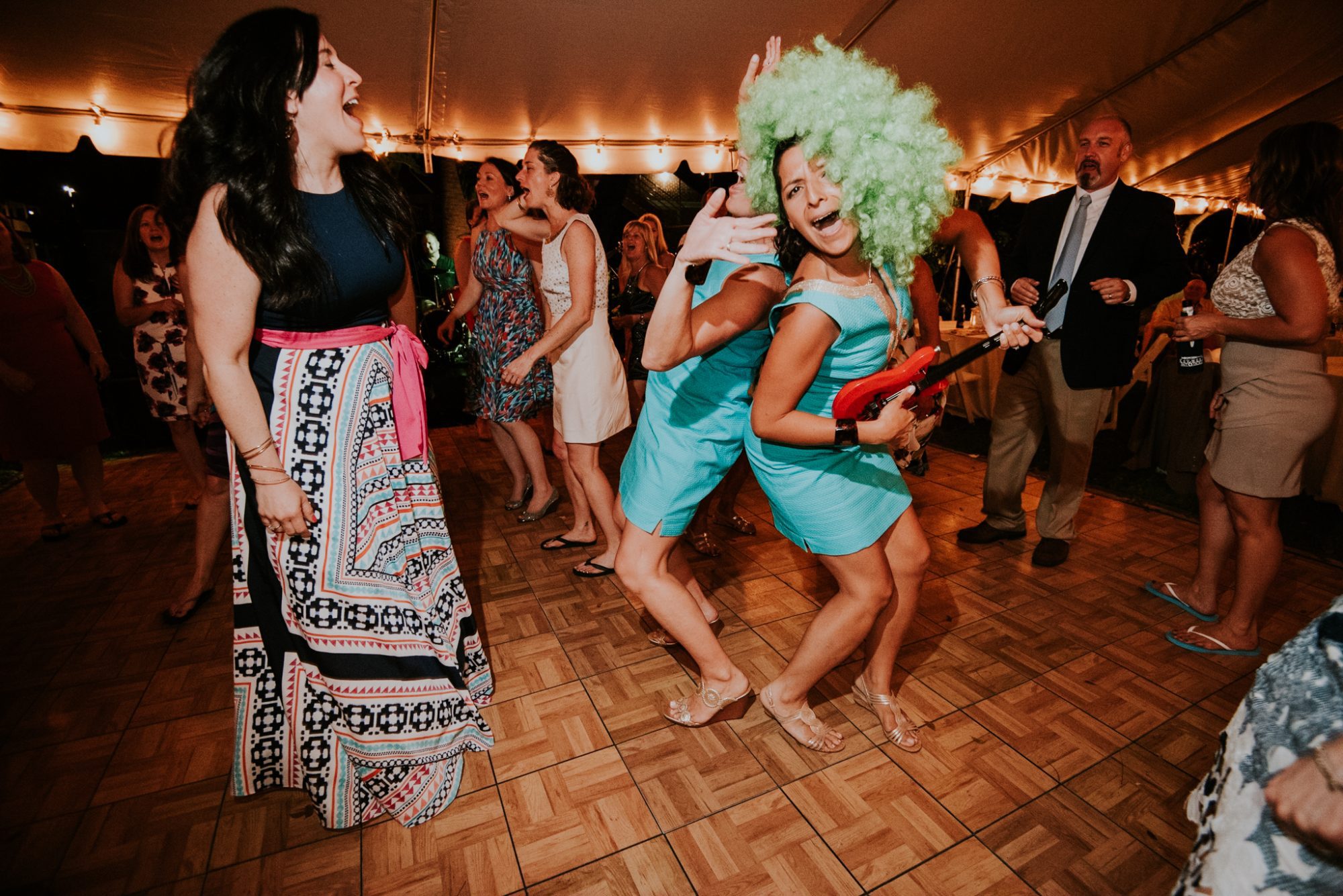 A group of women dancing on a dance floor at a wedding in Key West.