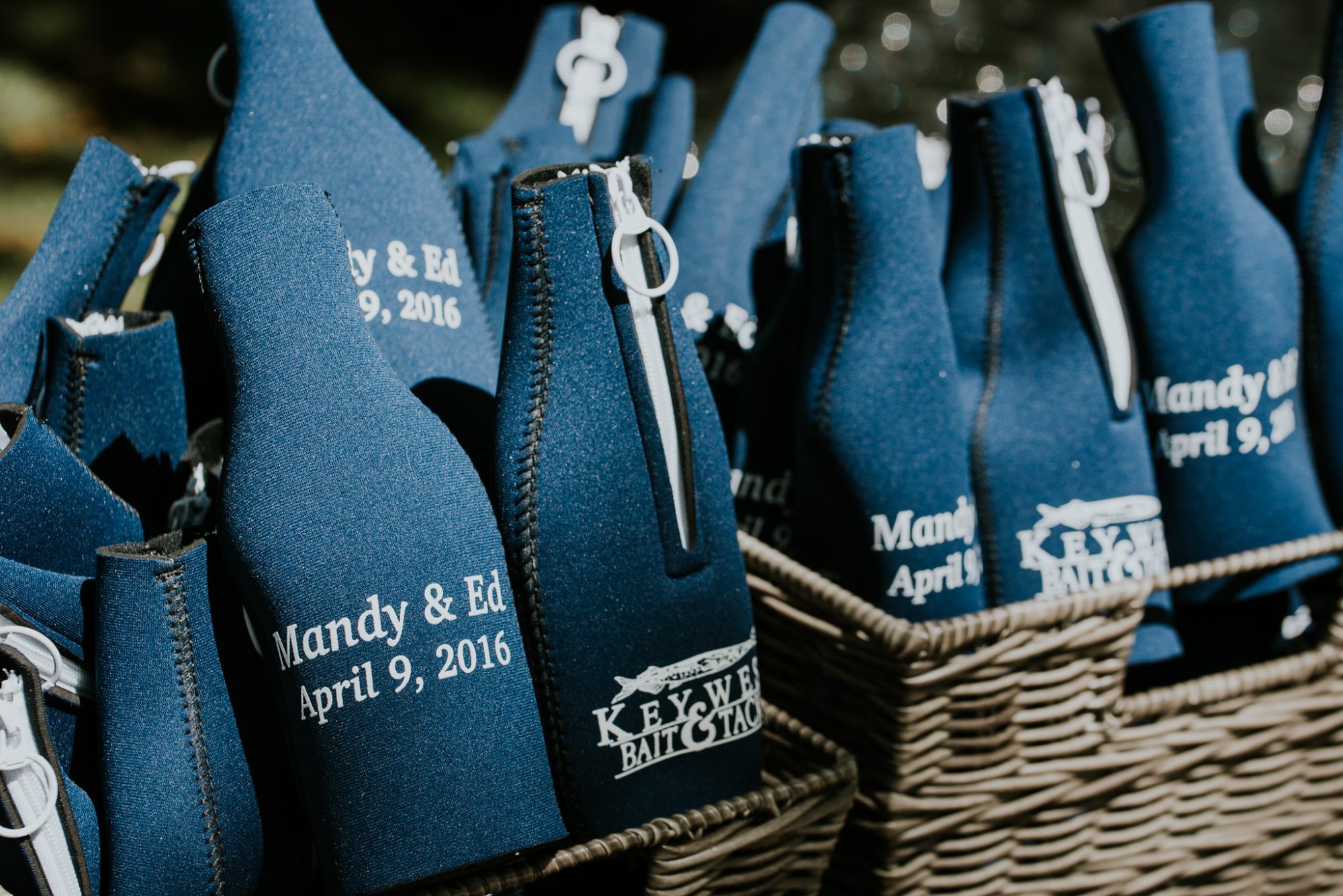 A group of blue wine bottles in a wicker basket, perfect for a Truman White House wedding in Key West.