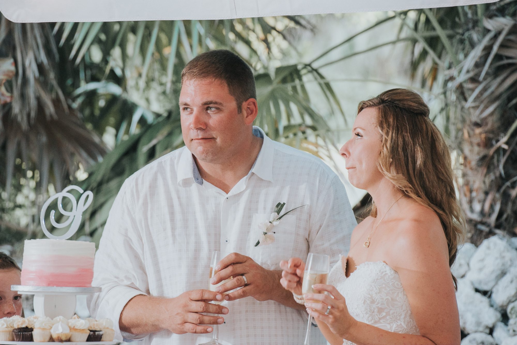 A bride and groom toasting at their destination wedding in the Florida Keys.