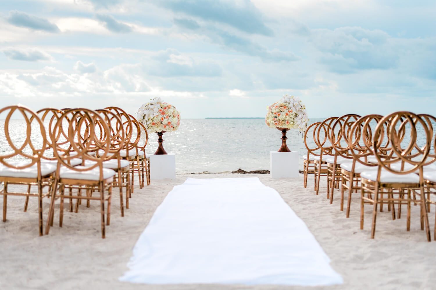 A Florida Keys wedding ceremony set up on the beach.