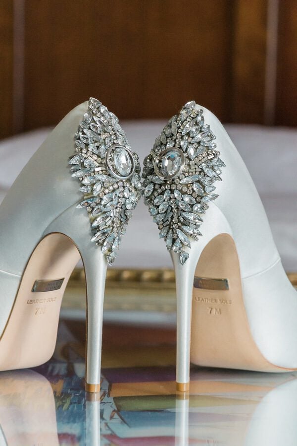 A pair of white wedding shoes with rhinestones perfect for a Key West wedding.