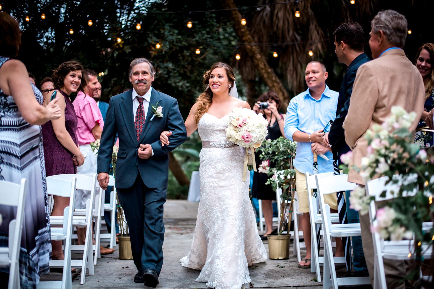 Wendy & Michael's Key West wedding captured by Freas Photography as the bride walks down the aisle with her father.