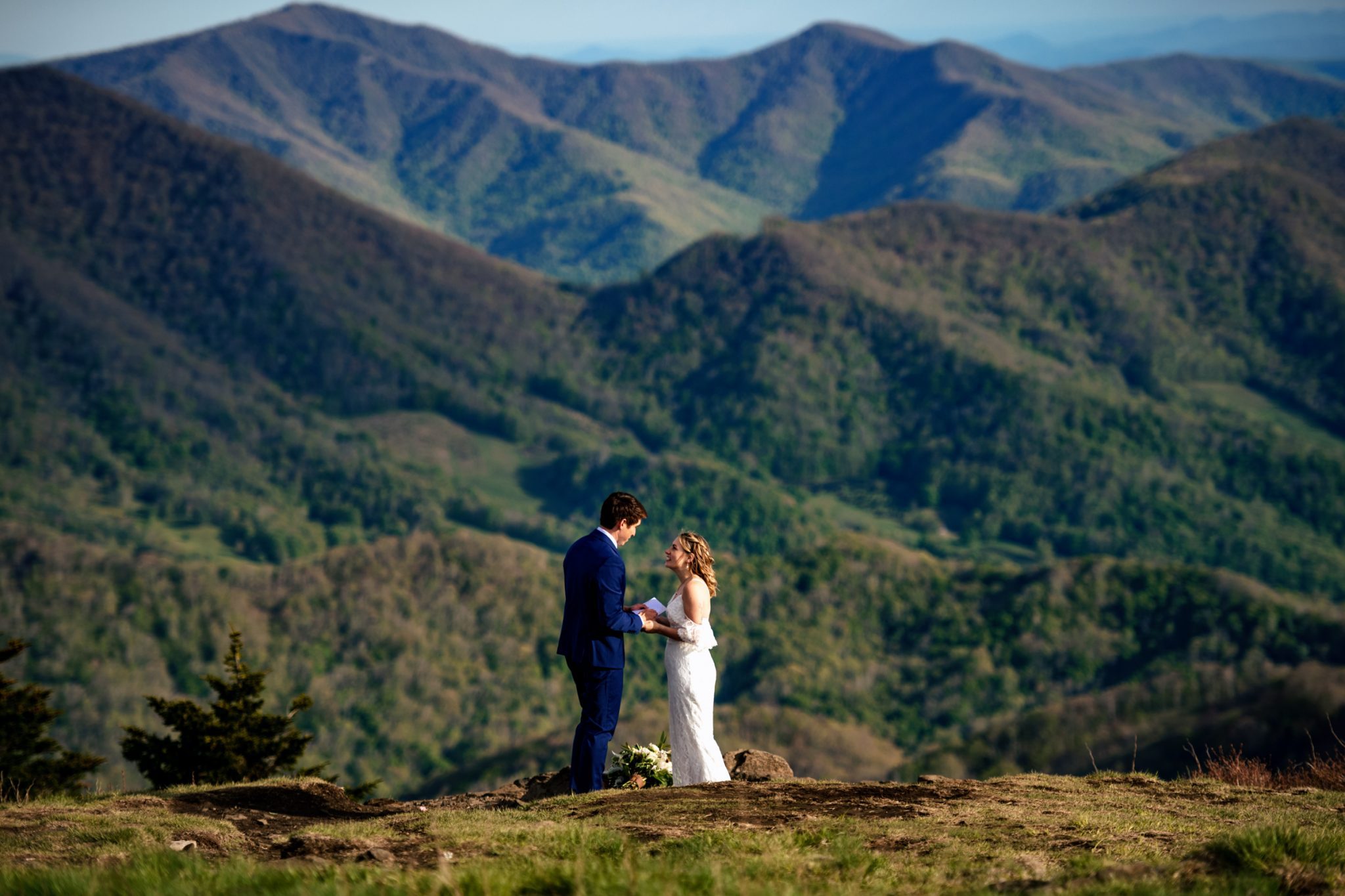 bride and groom on mountain top