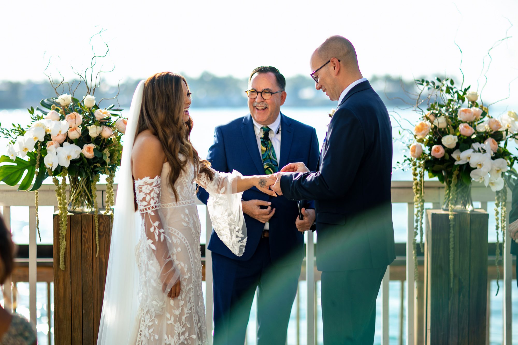A couple exchanges rings at their oceanfront Key West wedding ceremony at the Ocean Key Resort.