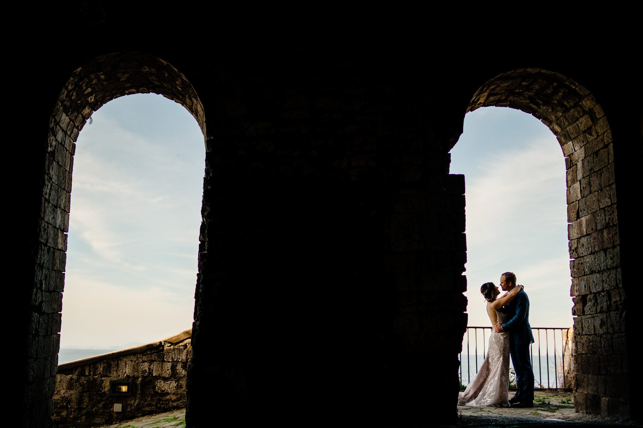 bride and groom on Amalfi coast in archways