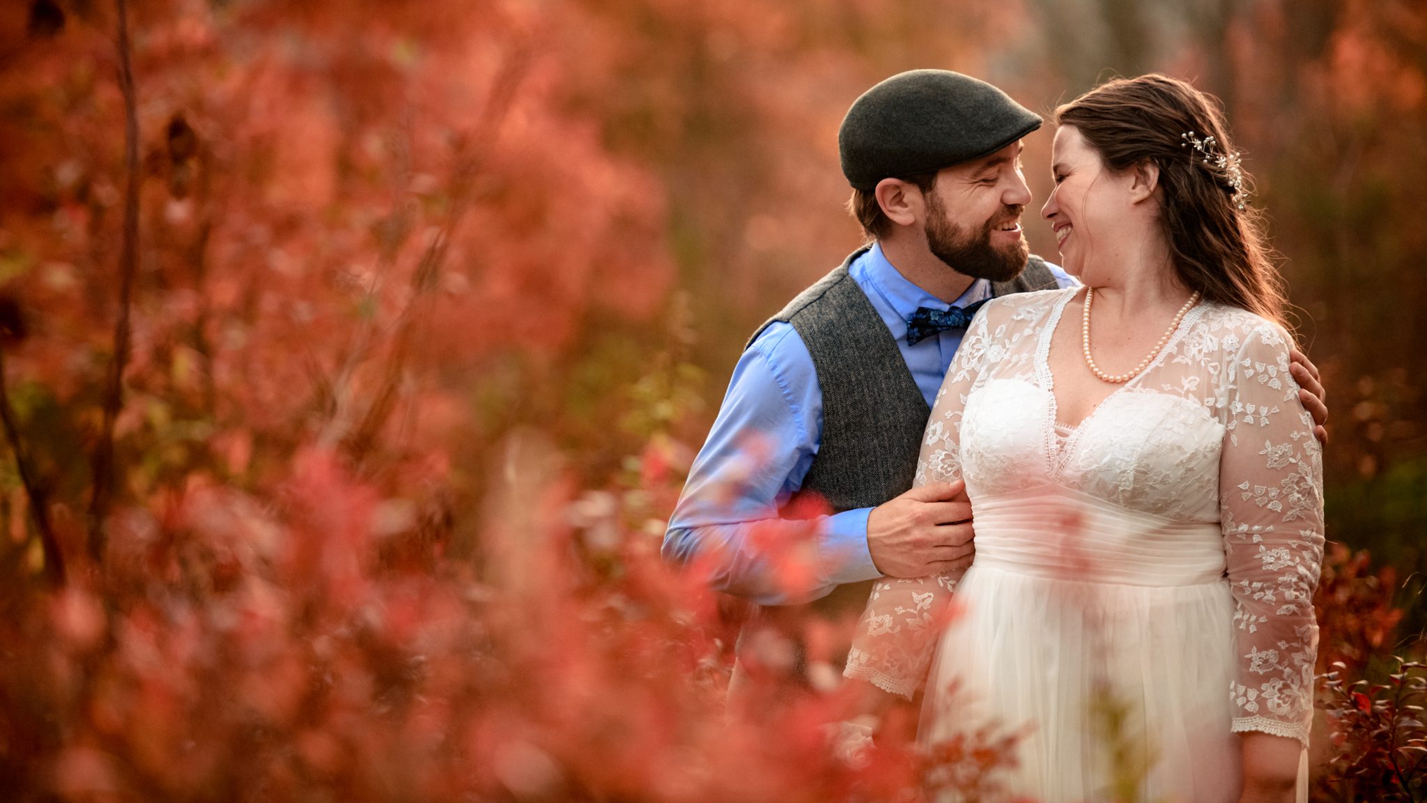 bride and groom at graveyard fields during fall