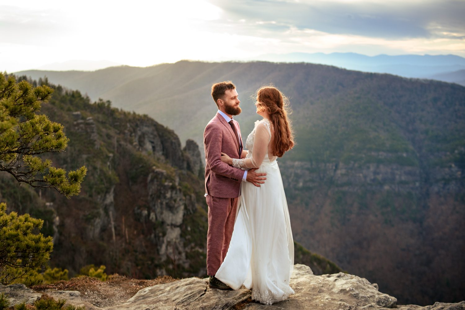 bride and groom on mountain top asheville elopement linville gorge