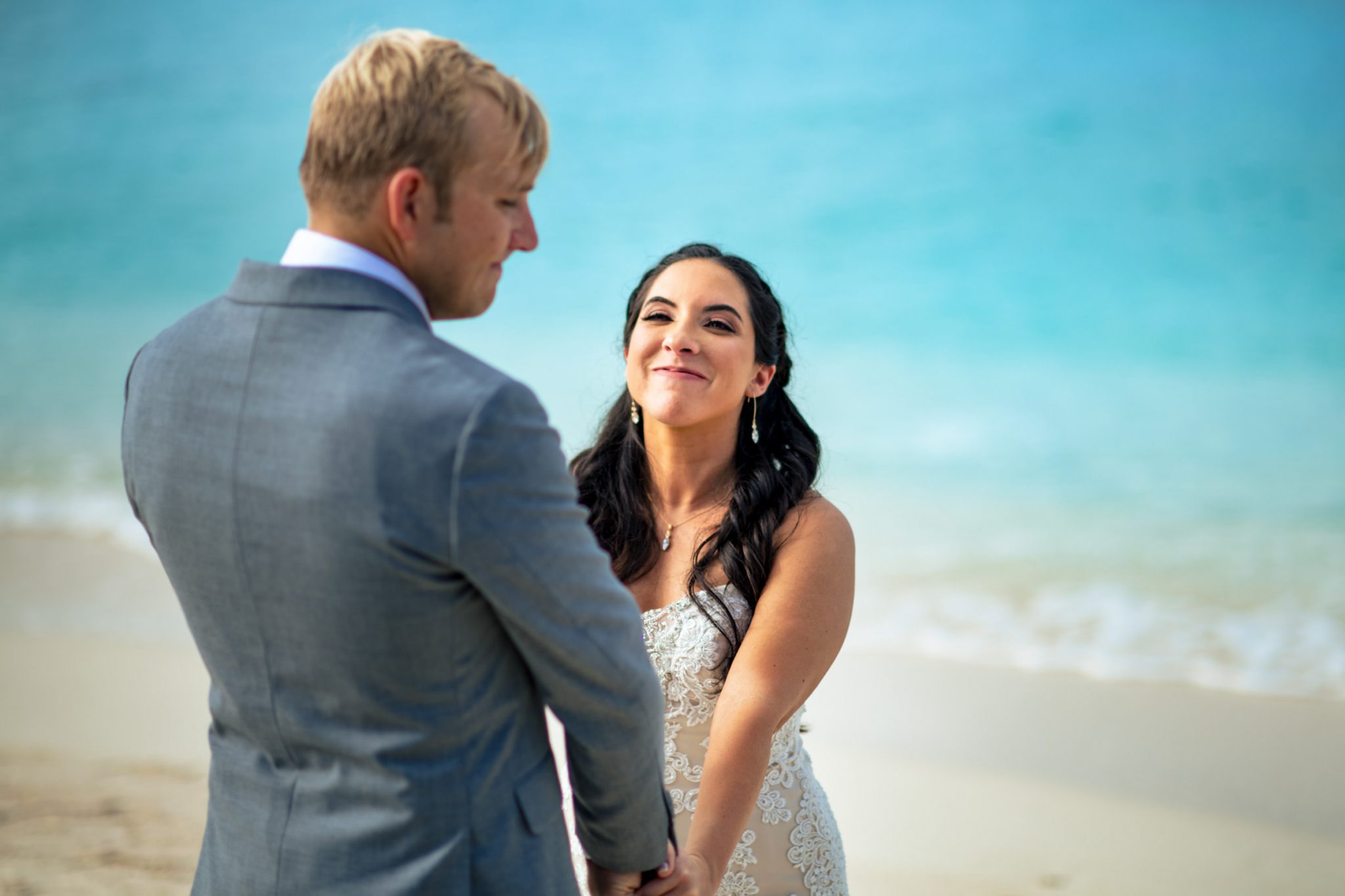 Bride smiling at her groom right before first kiss during wedding ceremony at dry Tortugas national Park