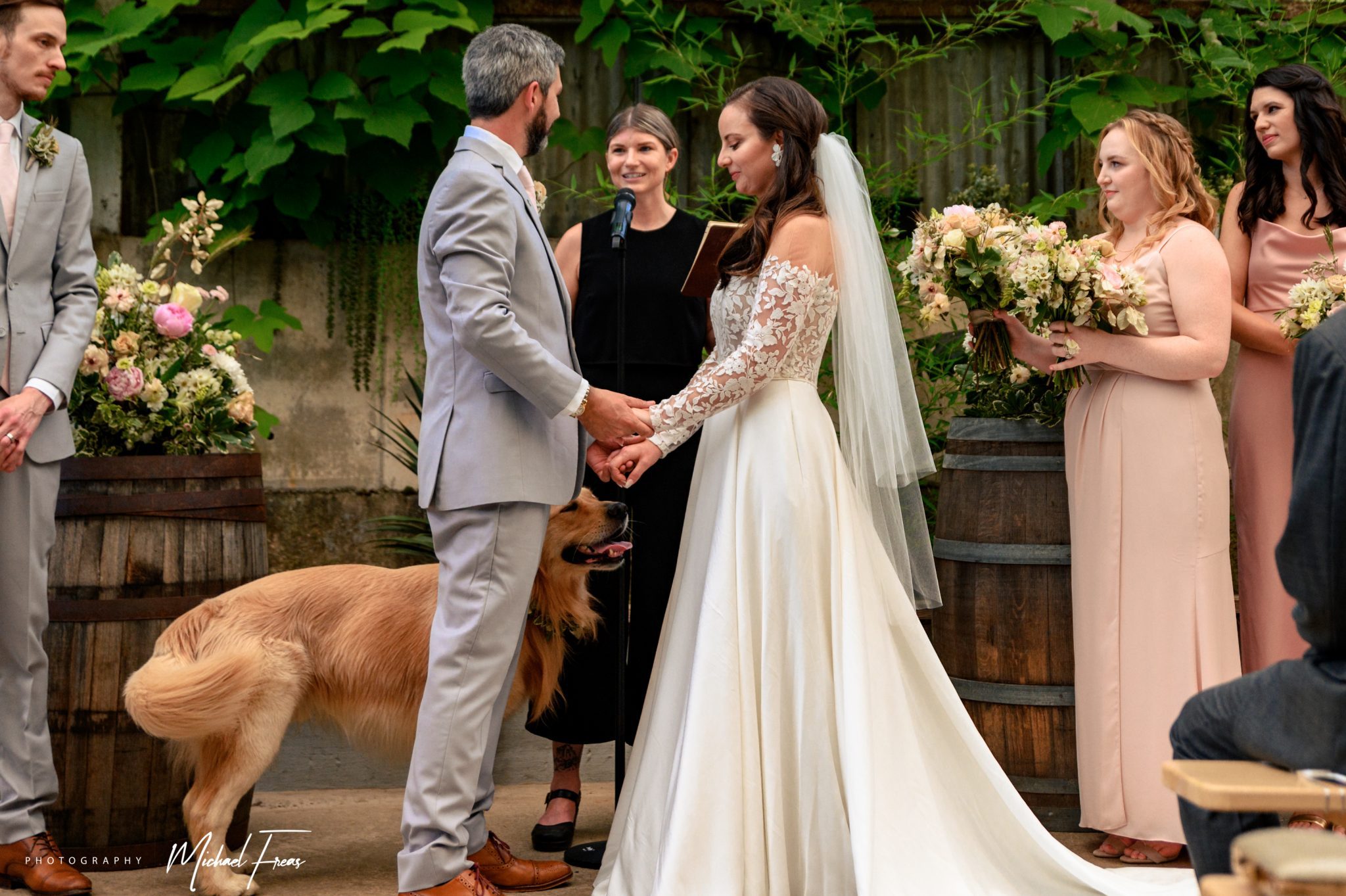bride and groom reciting wedding vows with dog hi-wire brewing event space in Asheville North Carolina