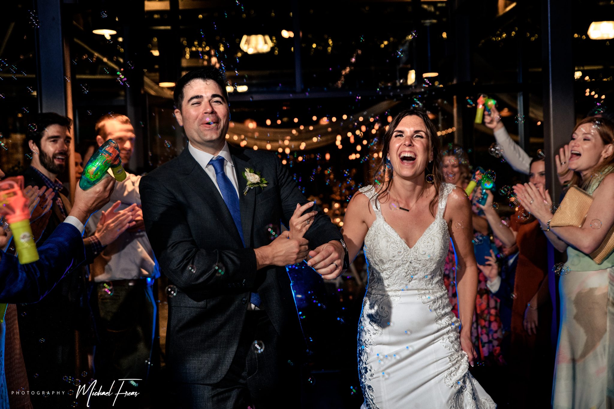 bride and groom making special exit through bubbles after wedding reception at crest pavilion
