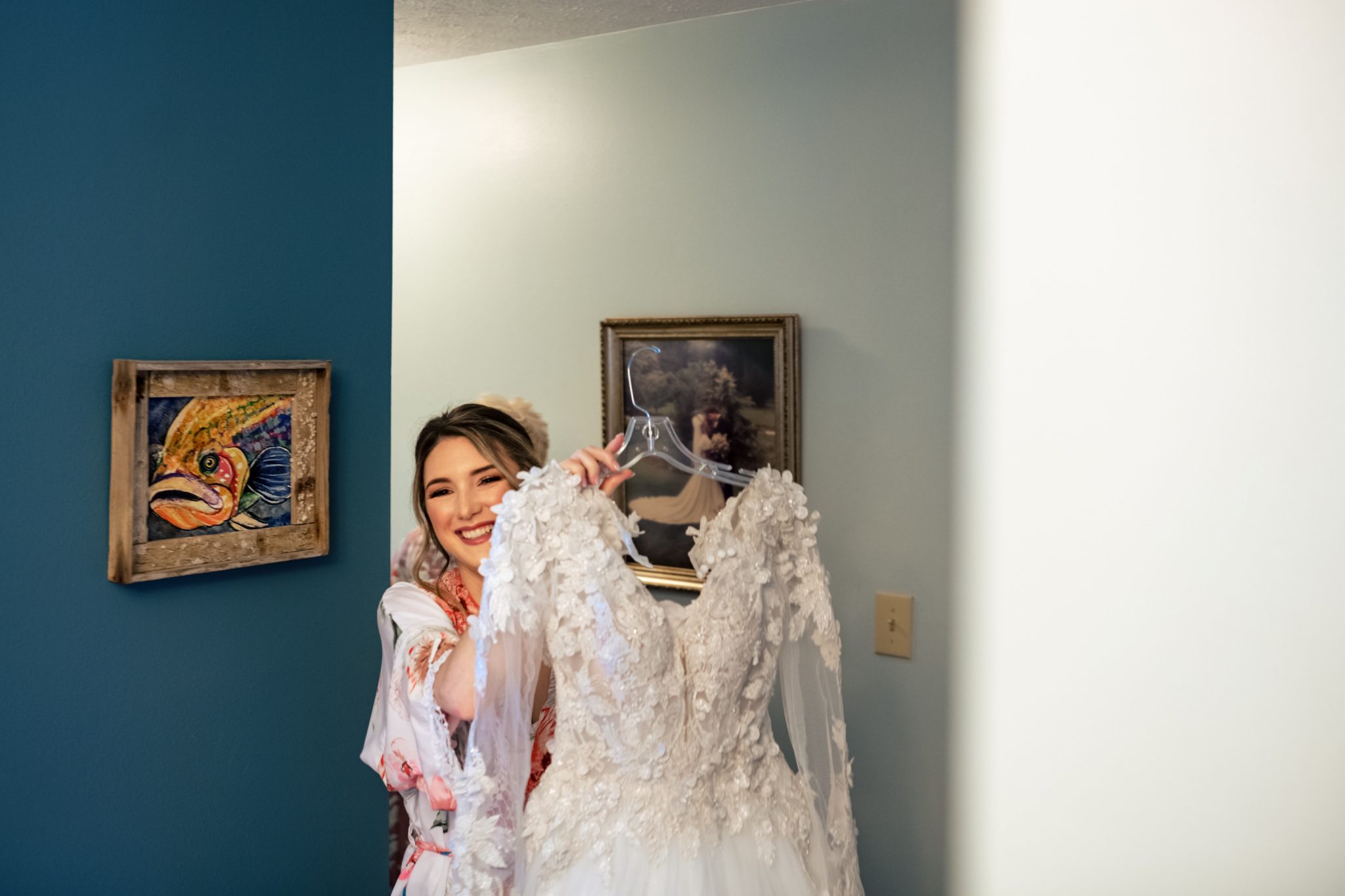 A fall bride preparing for her wedding in a hallway.