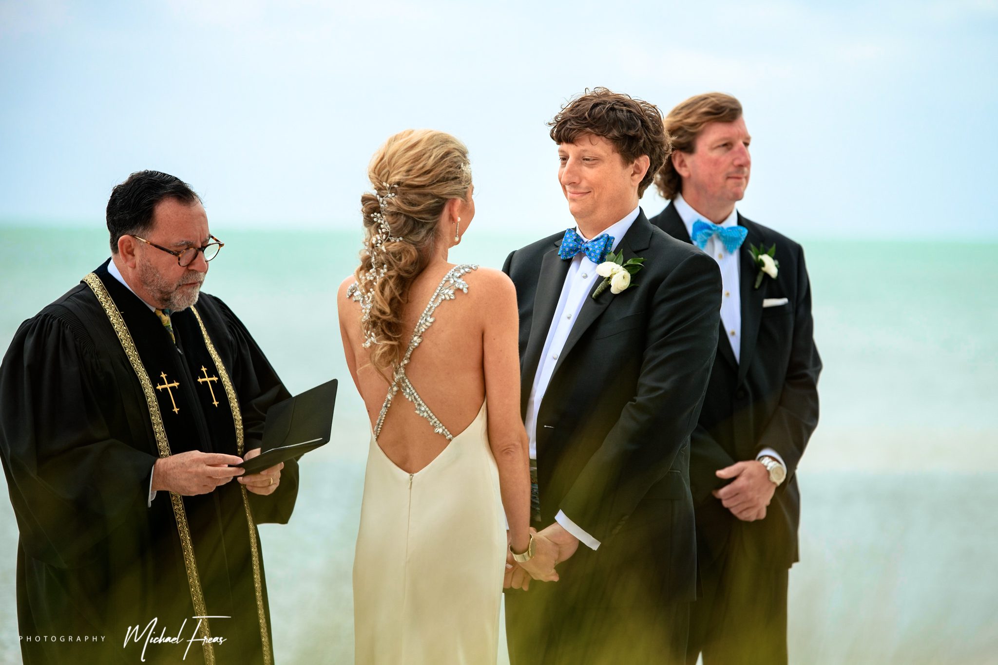 A couple celebrates their destination wedding on Sunset Key beach in the Florida Keys.