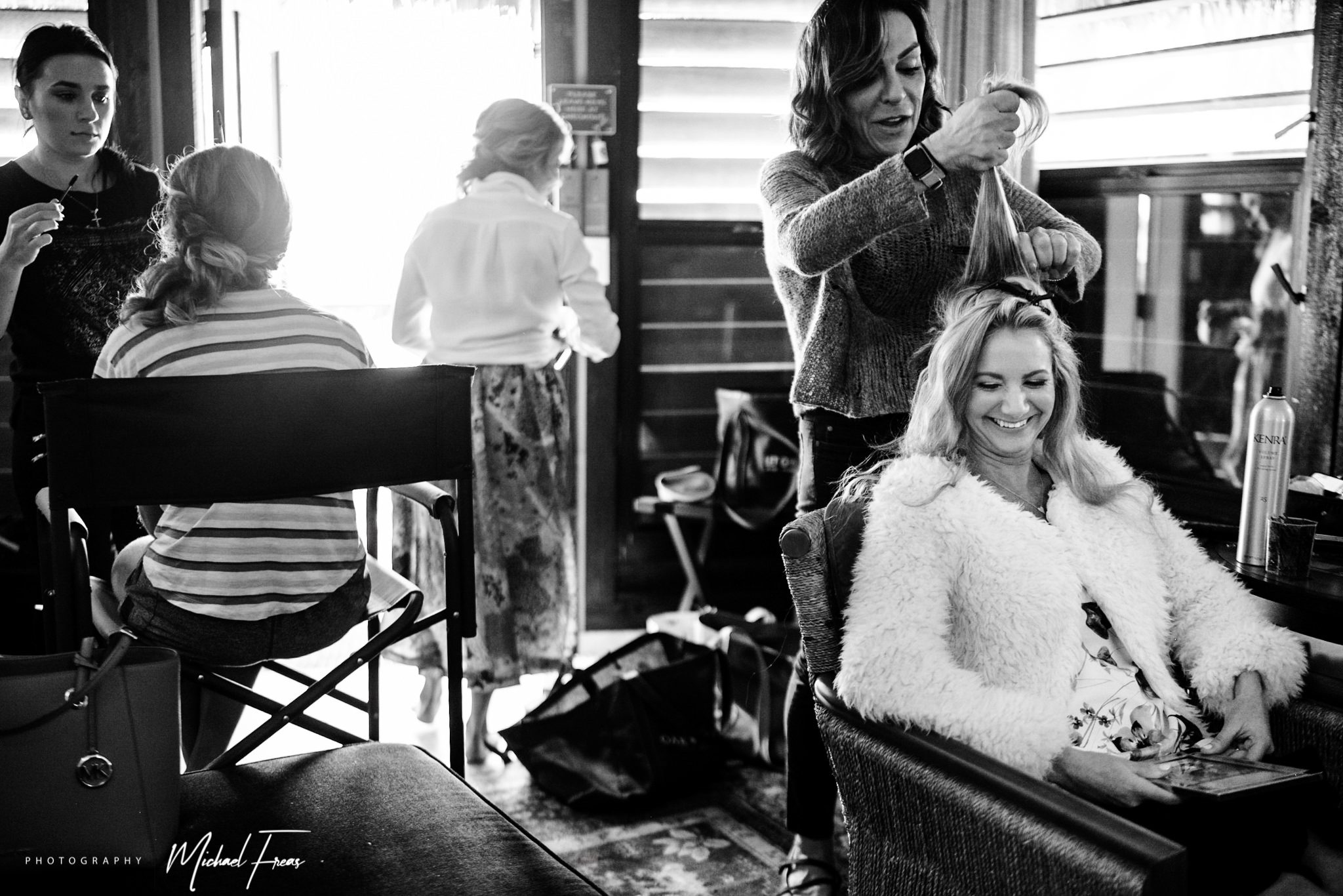 A woman getting her hair done for a Florida Keys destination wedding.