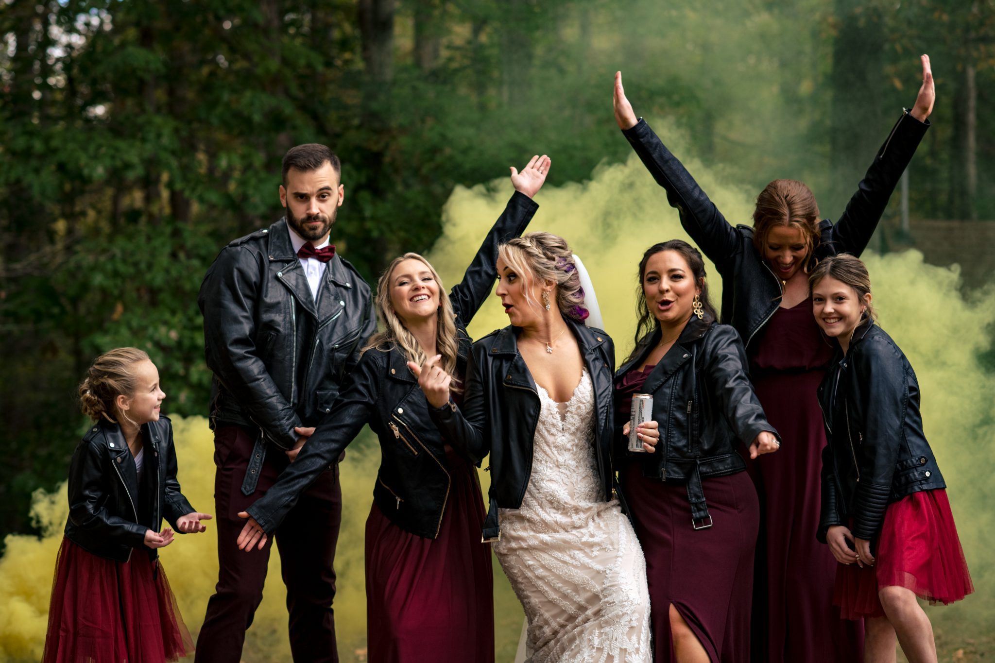 Bride and bridesmaids playing with smoke bombs