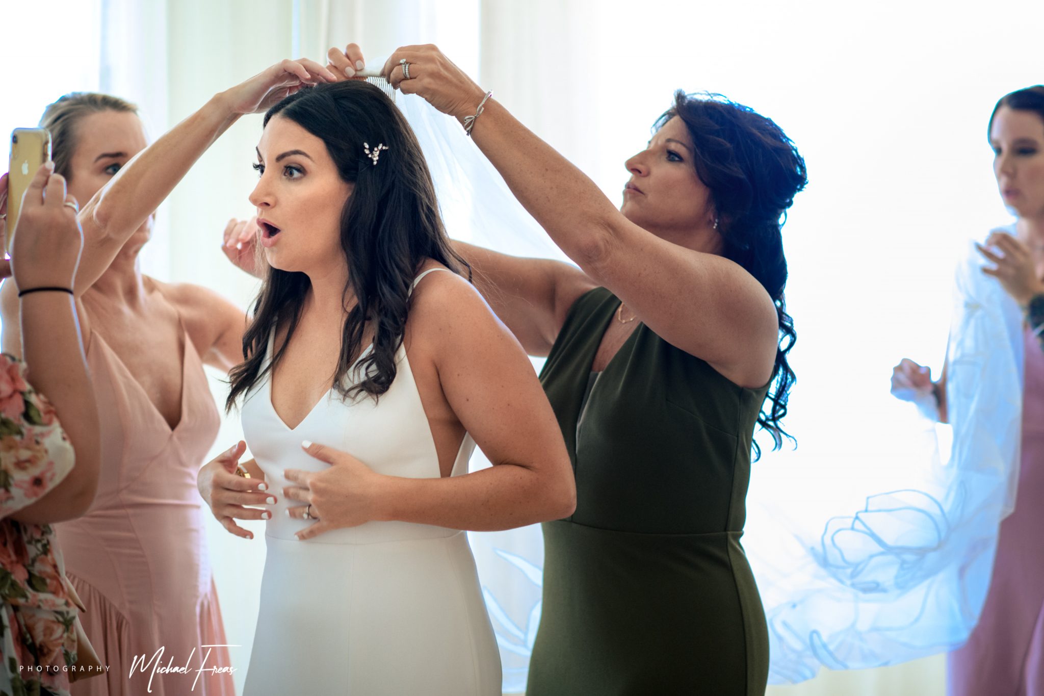 bride putting on final touches inside reach resort
