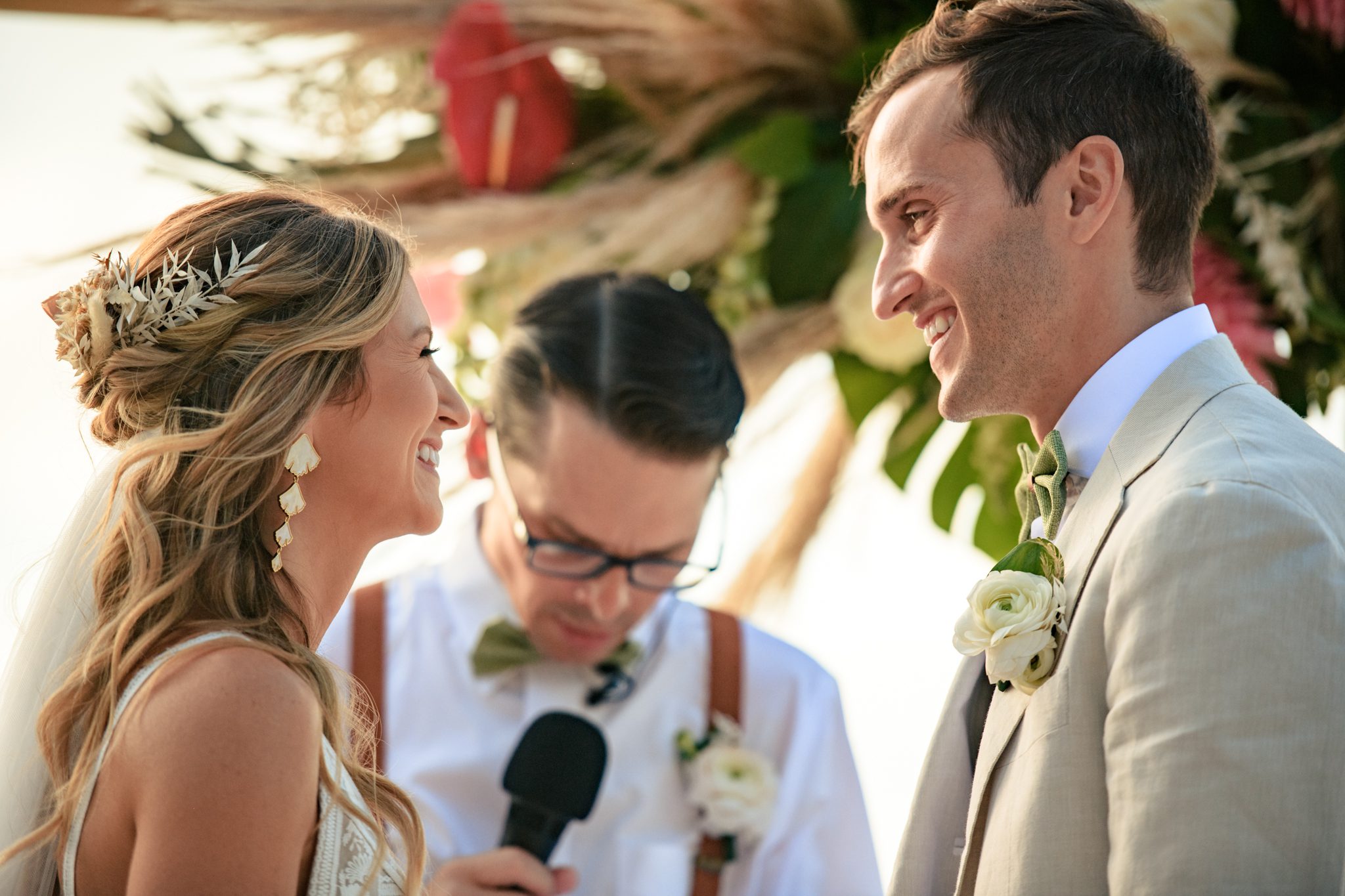 bride and groom smiling during wedding ceremony at playa largo resort