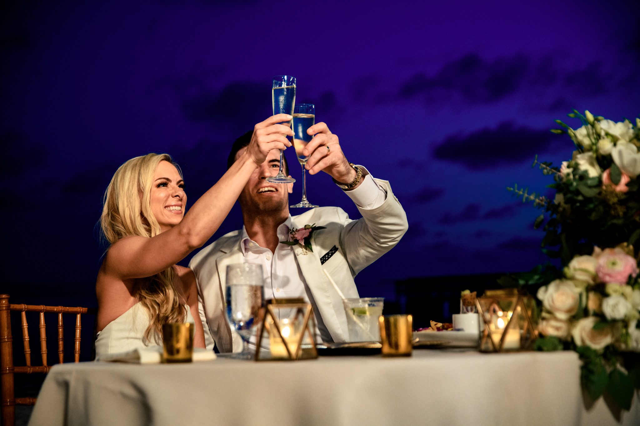 A Casa Marina Key West wedding with a bride and groom toasting at their reception.