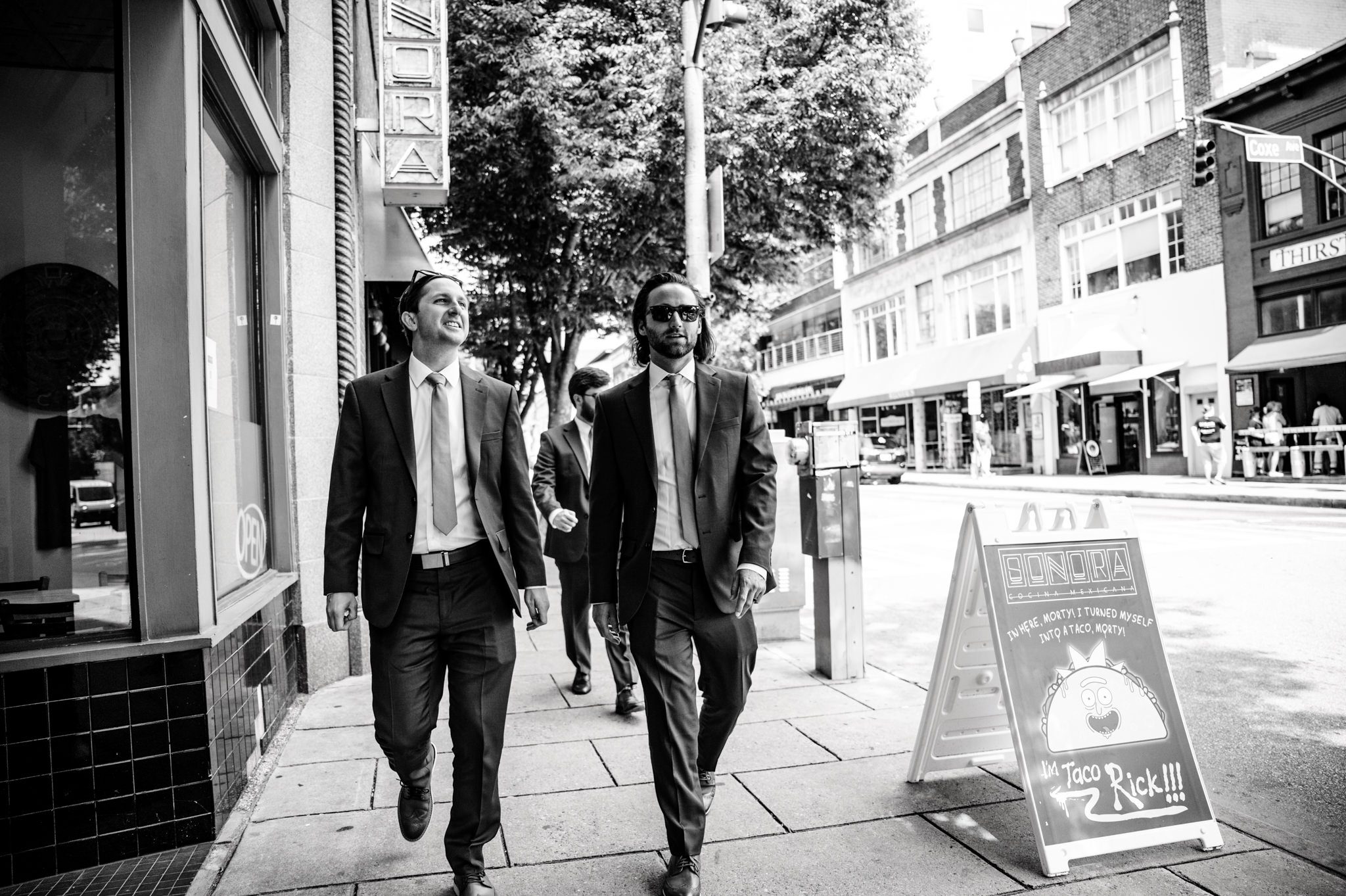 groom and groomsmen walking through downtown asheville