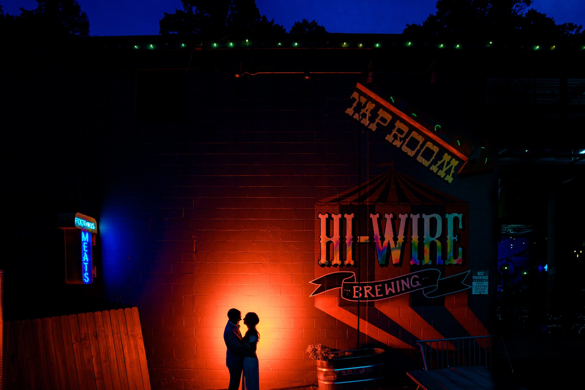 just married couple in front of hi-wire brewing