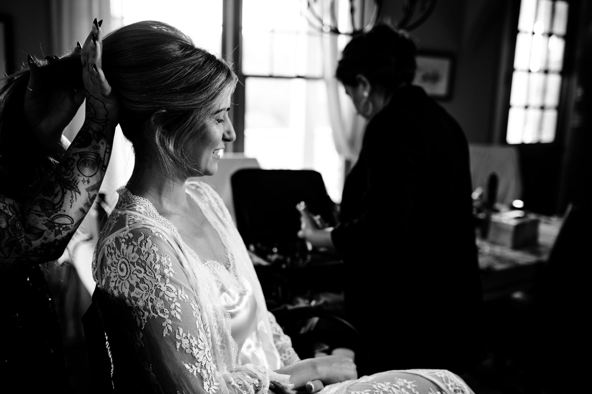 A bride and bridesmaids get their hair and make up done at the residence at the Ridge Asheville