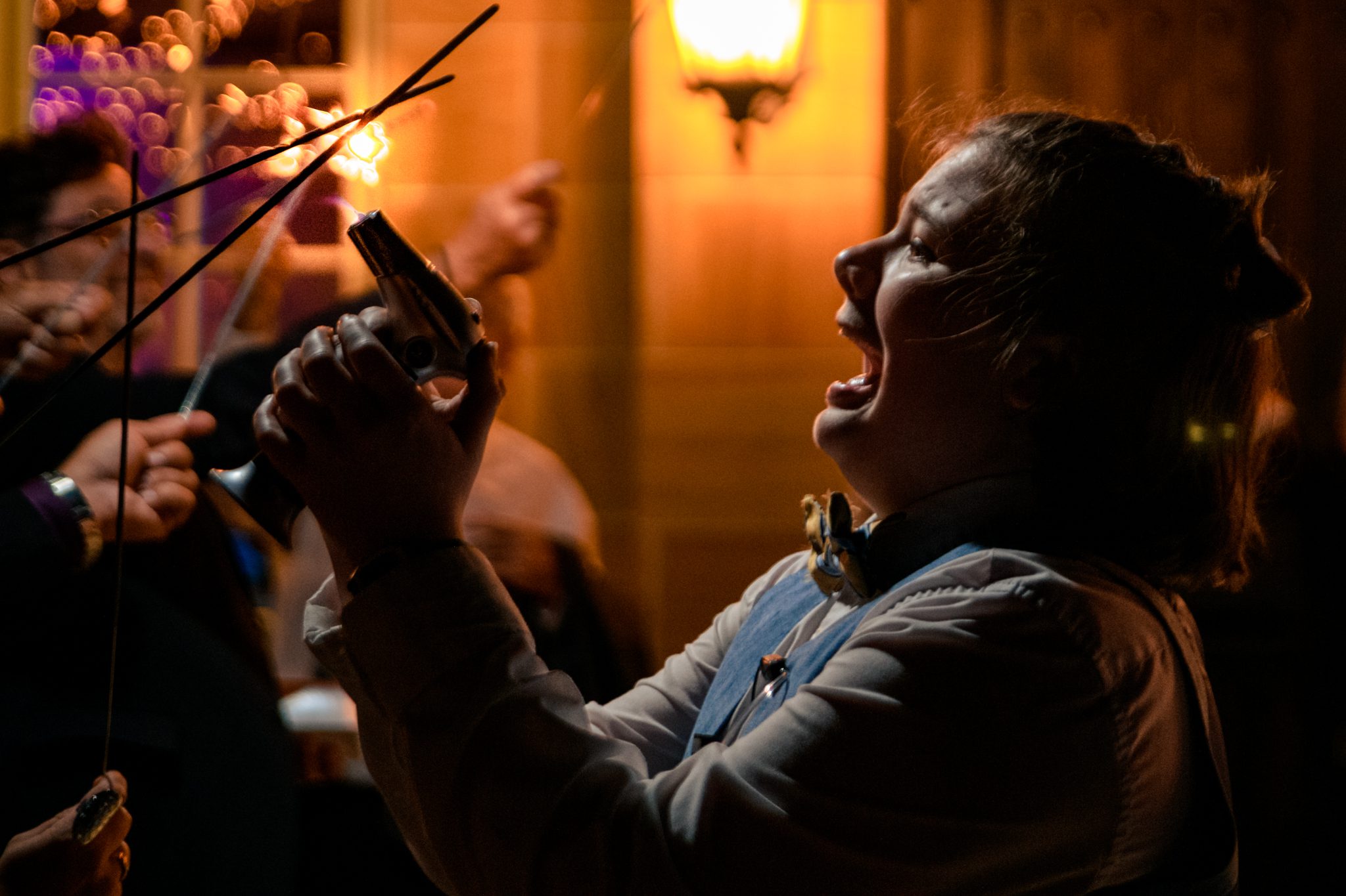 a member of the ridge asheville staff lights sparklers