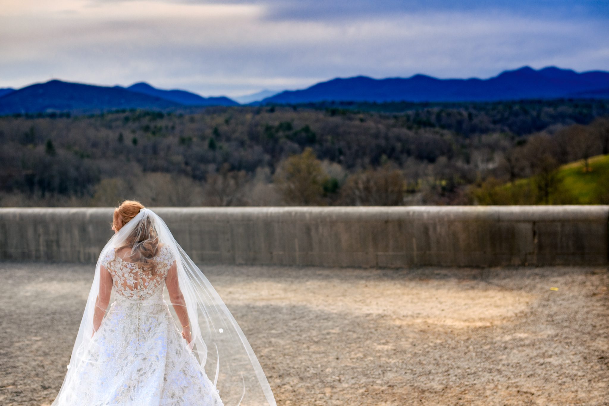 bride with flowing veil on south terrace of biltmore estate
