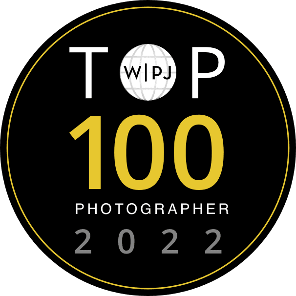 top 100 wedding photographer 2022 award from wedding photojournalist association