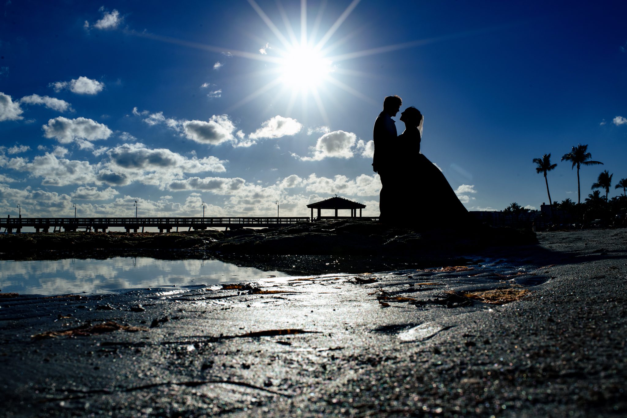 silhouette of bride and groom on beach at casa marina resort